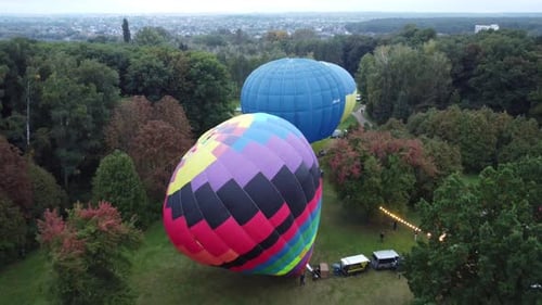 Aerial View: Colorful Hot Air Balloons in Park