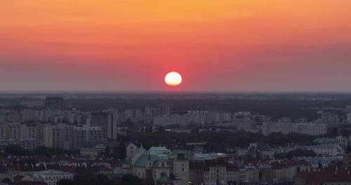 a sunset over a city