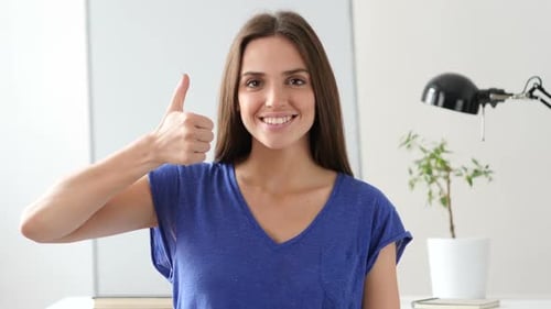 Smiling Woman Giving Thumbs Up Approval