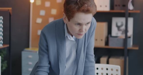 Adult Reviews Charts at Office Workplace Desk