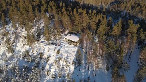 Aerial View Of Typical Cabin With Pine Trees During Winter In Kragerø, Telemark, Norway.