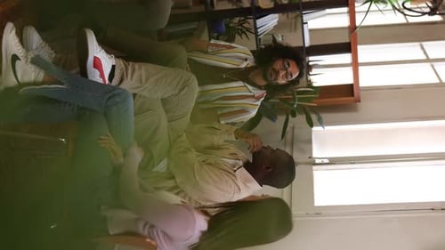 Group of Friends Talking Together Indoors