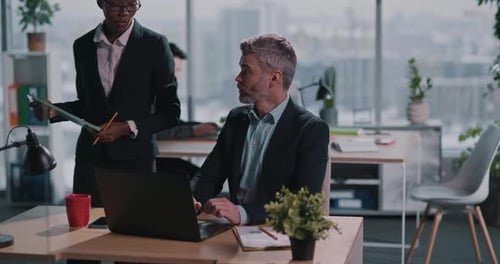 Office Workers Discussing a Document