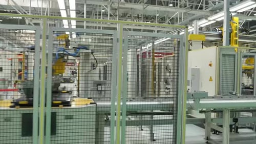 Technology workshop new robotic arms in high-tech industrial automation setup, Professional robotic