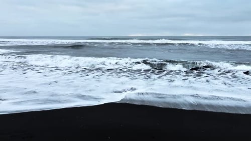 Black Sand Beach with Crashing Waves Serene and Tranquil Landscape Ocean Coast with Calm Waves