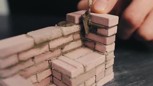 Miniature Brick House Construction with Trowel Tiny Brickwork and Cement Wall