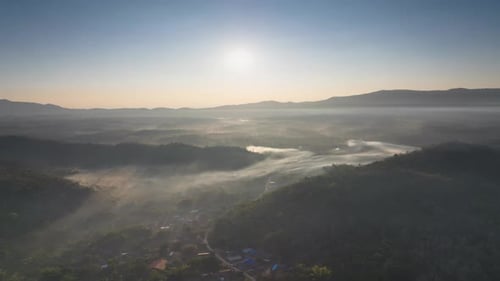Aerial view Beautiful of morning scenery Golden light sunrise And the mist flows on high mountains.