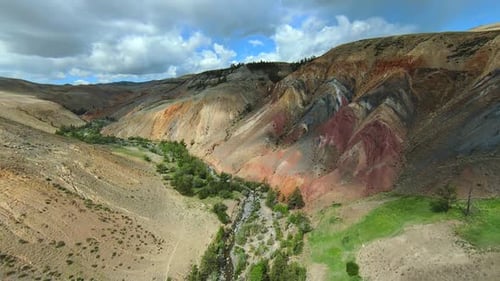 Amazing multicoloured pattern of geological formation resembling a Martian landscape, drone footage.