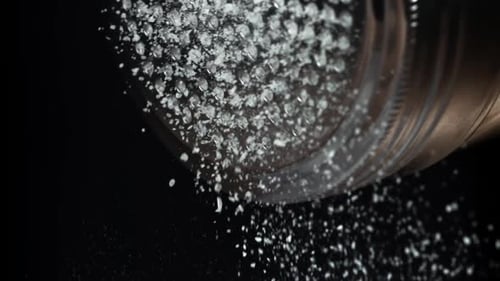 Salt is Pouring Out of the Salt Shaker Filmed on a Highspeed Camera at 1000 Fps