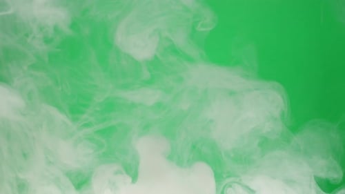 Smoke on Green Chroma Key Background Smoking Steam Clouds of Vapour Closeup Burning Fog