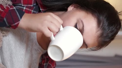 Young Adult Woman Drinking Coffee Close Up Portrait