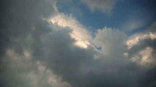 Dramatic Clouds Moving Across the Blue Sky