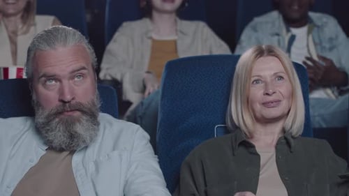 Mature Couple Watching Comedy At Cinema