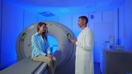 Medical Worker Explaining CT Scan Results to Patient in Hospital Setting MRI Machine and