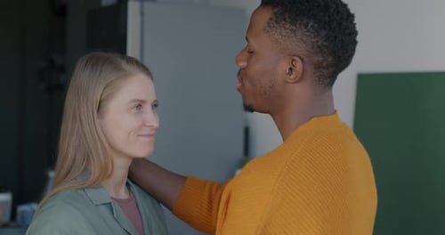 Affectionate Couple Embracing in Cozy Home Setting