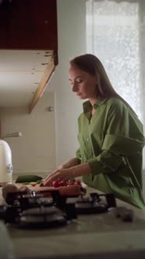 Woman Chopping Vegetables in Home Kitchen