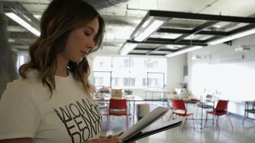 Portrait Confident Creative Businesswoman Reviewing Paperwork in Office 3539 Years