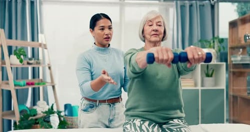 Senior care, physiotherapy and caregiver with old woman, dumbbell and healthcare at nursing home