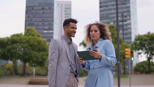 Man and Woman Talking in an Urban Setting