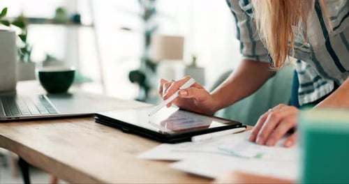 Woman Uses Tablet and Stylus for Work at Home