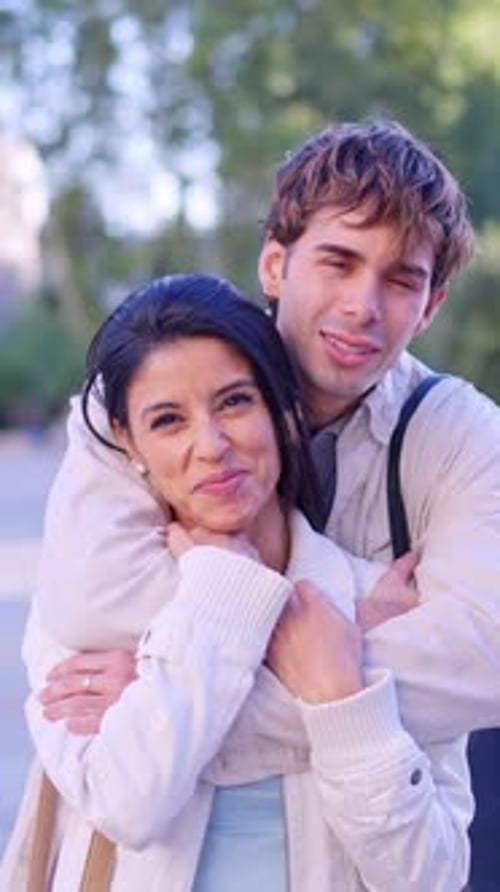 Smiling Couple Embracing in an Urban Setting