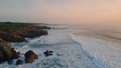 Evening Rocky Coastal Landscape Aerial Foaming Sea Splashing on Rough Cliffs