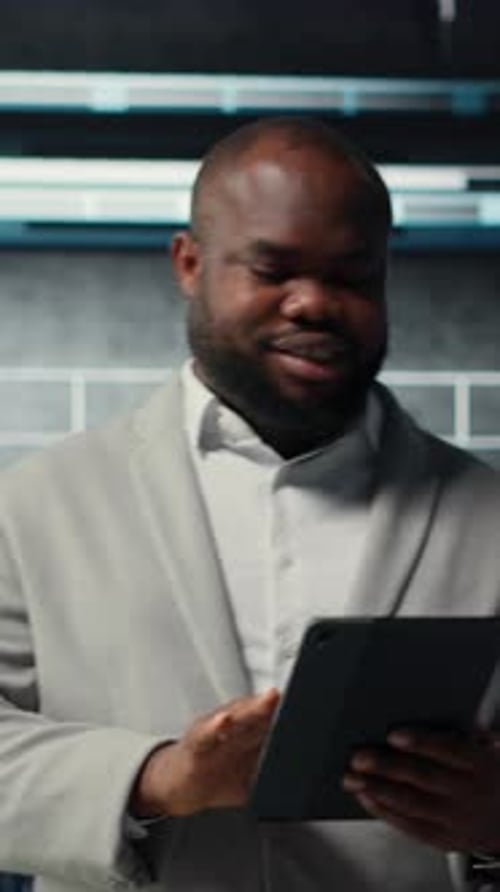 Vertical Video Server Farm Employee Upgrading Gear for Increased Processing