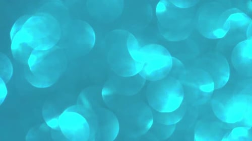 Abstract Turquoise Bokeh Circles Shimmering Gently