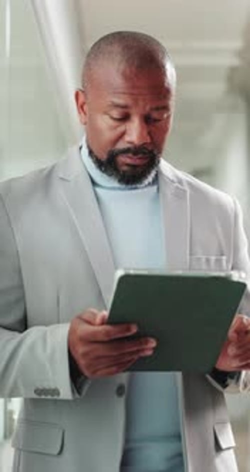 Black man, tablet and typing at office with proposal, policy review and smile by window at insurance
