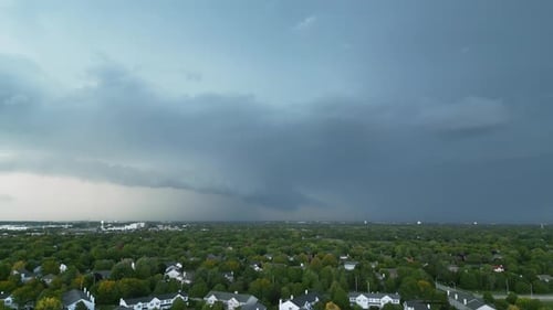 Aerial View of Suburban Neighborhood Under Cloudy Skies