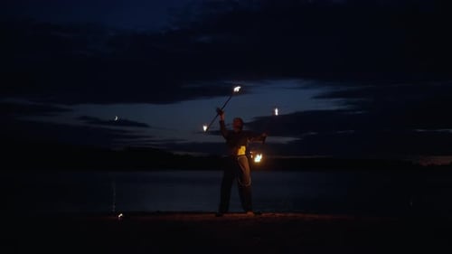 Female Juggler Performing Tricks With Fire Juggling Burning Torches Silhouette Of Woman