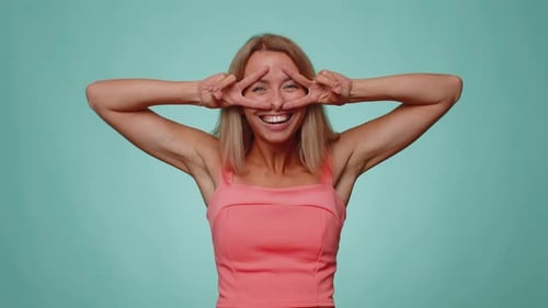 Funny Joyful Woman Making Playful Silly Facial Expressions Grimacing Fooling Around Showing Tongue