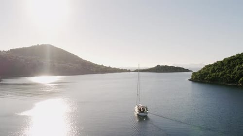 Aerial Top Down View of Rich Yacht Sailing Sea