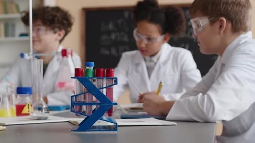Preteen School Kids Studying Chemistry in Class