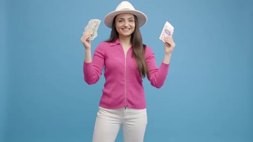 Cheerful Woman Holding Money and a Gift