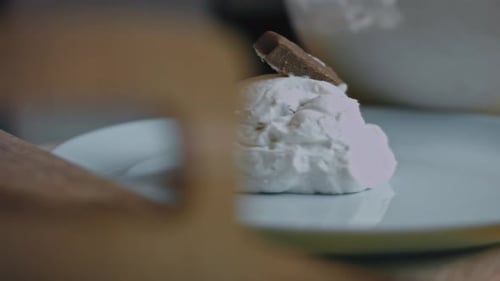 Creamy Dessert Topped with Chocolate Piece