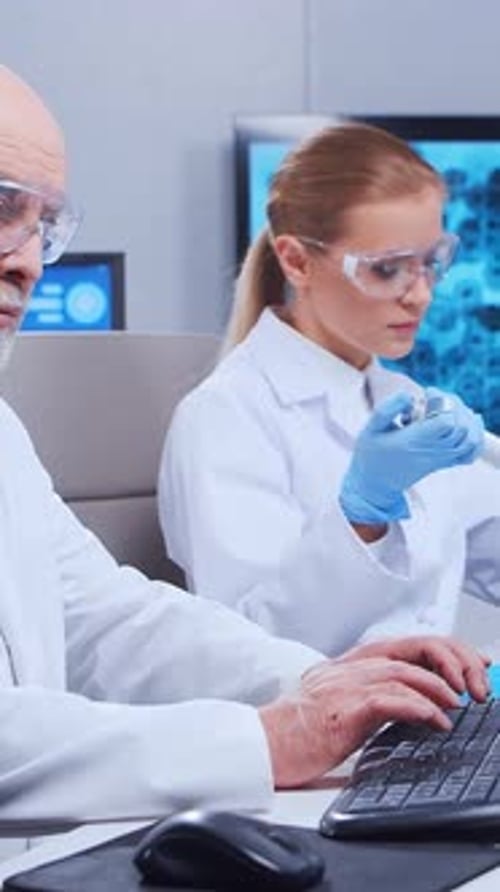 Two Scientists Working in a Medical Research Lab