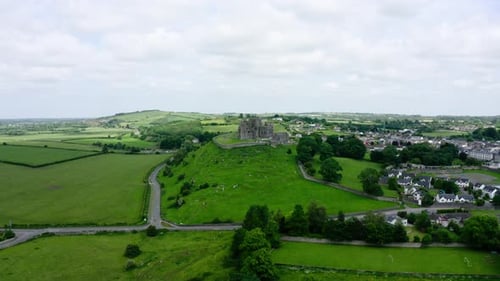 Drone approaching an abandoned castle in Ireland's countryside.