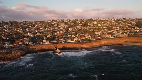 Aerial pan of bluffs and homes at Sunset Cliffs in San Diego