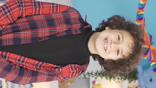 Vertical Video of Close-up portrait of happy positive boy.