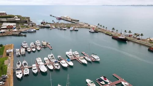 Aerial View of Luxury Private Yachts and Boats Docked in a Tropical Harbor