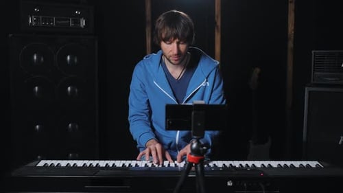 Professional Piano Teacher Conducts an Master Class with Student Via Video Call