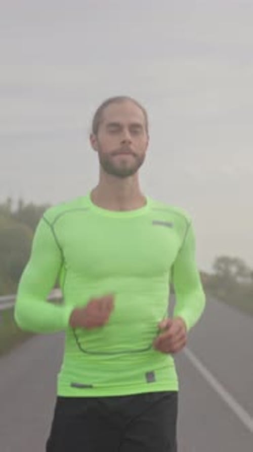 Man Running on Rural Road in Exercise Gear