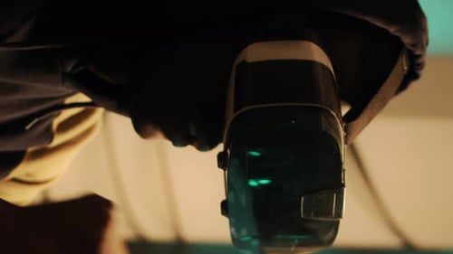 Hacker in Gas Mask Working at Multiple Computers