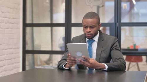 African Woman Working on Digital Tablet