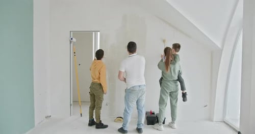 Family Painting Together in New Home