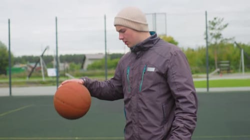 Basketball Outdoors Action Bearded Athlete Practices Shot Under Cloudy Sky Casual Training Session
