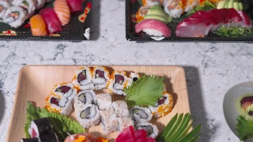 Drop Down Shot of Table Full of Assorted Sushi Rolls | Various Sushi Types | Japanese Cuisine