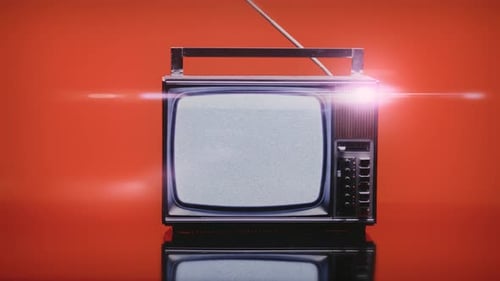 Vintage Television with Static on a Red Background
