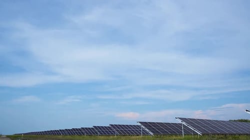 Rows of Solar Panels in a Rural Landscape